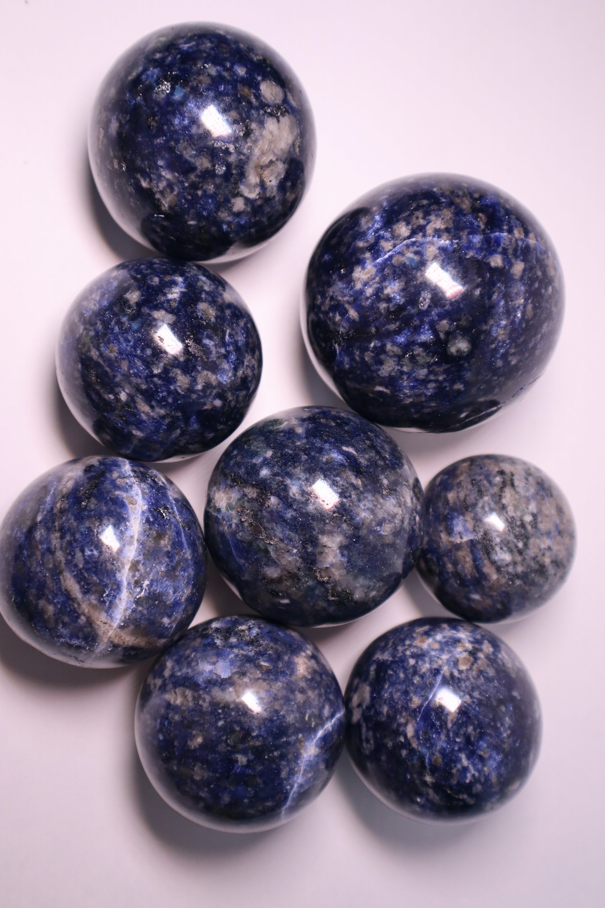 Sodalite: A captivating deep blue crystal mottled with white veins, is esteemed for its harmonizing properties that bridge the gap between logic and intuition. With its serene and calming energy, Sodalite is believed to enhance mental clarity, promoting rational thought and aiding in effective communication.