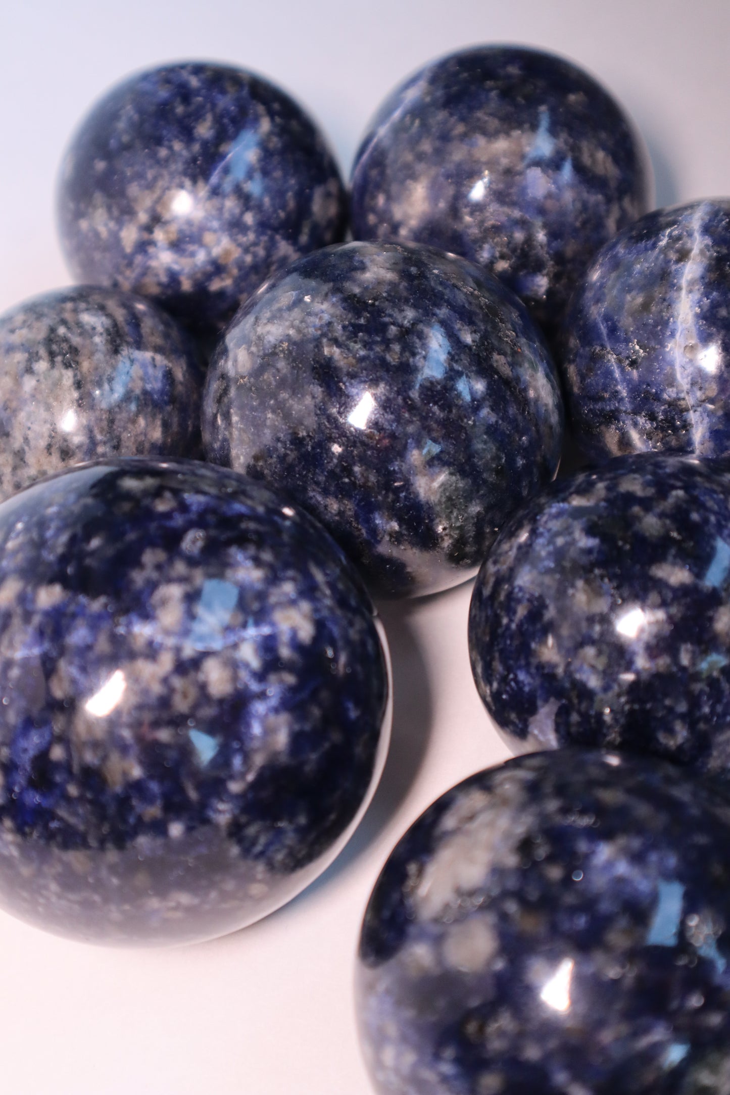 Sodalite: A captivating deep blue crystal mottled with white veins, is esteemed for its harmonizing properties that bridge the gap between logic and intuition. With its serene and calming energy, Sodalite is believed to enhance mental clarity, promoting rational thought and aiding in effective communication.