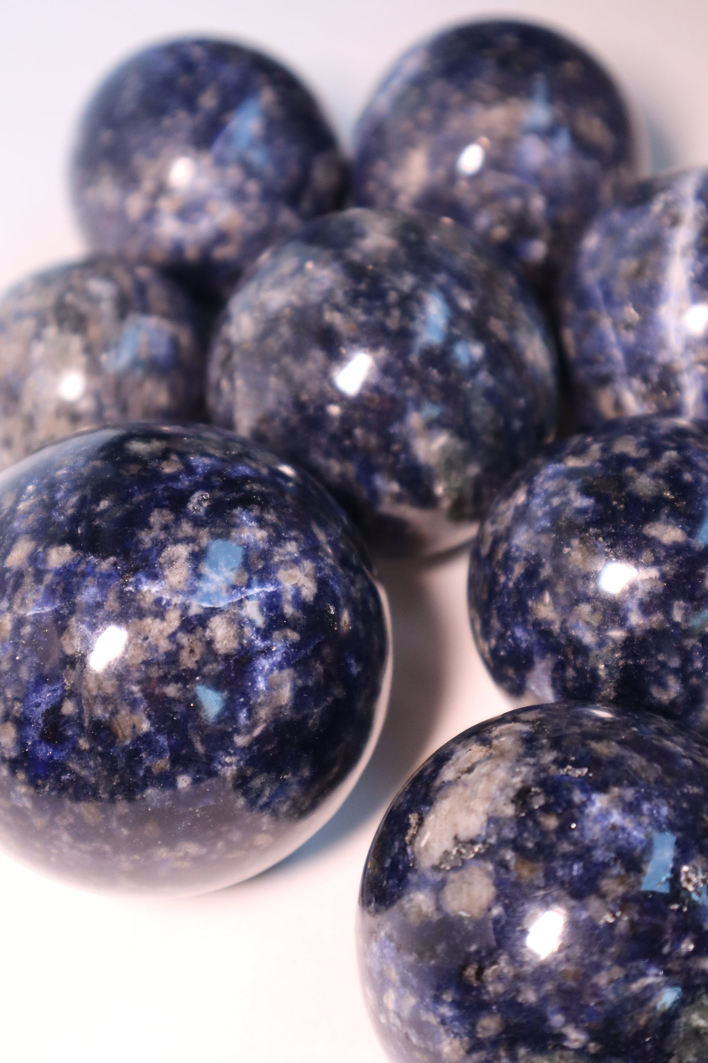 Sodalite: A captivating deep blue crystal mottled with white veins, is esteemed for its harmonizing properties that bridge the gap between logic and intuition. With its serene and calming energy, Sodalite is believed to enhance mental clarity, promoting rational thought and aiding in effective communication.