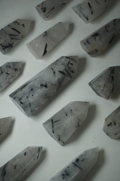 Rutile Quartz: A mesmerizing crystal characterized by golden or reddish-brown needle-like inclusions, is cherished for its powerful energetic properties.